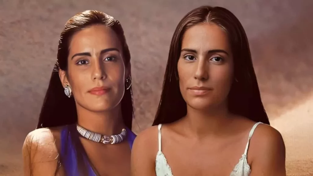Glória Pires aparece na imagem com sua personagem Raquel ao lado da irmã Gêmea, Ruth, também interpretada por ela (Foto: Divulgação / Resumo Mulheres De Areia)